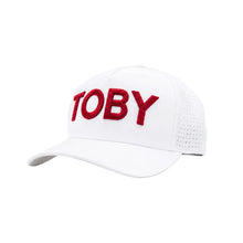 Load image into Gallery viewer, A white baseball cap with red embroidered text reading 'TOBY' on the front, shown against a plain white background.

